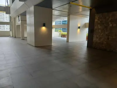 a hallway of an office building with a tile floor at Condo 2 bedroom victoria de makati in Manila