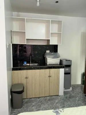 a kitchen with a sink and a counter top at W Tramo Residences in Manila