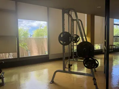 a gym with two tread machines in a room at Radiance Manila bay 2 br & 3 bath in Manila