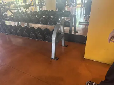 a rack of dumbbells in a gym at Radiance Manila bay 2 br & 3 bath in Manila