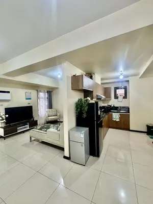 a large room with a kitchen and a living room at Radiance Manila bay 2 br & 3 bath in Manila