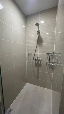a shower with a glass door in a bathroom at 2 bedroom Luxury Condo in Eastwood with Scenic City view, unli wifi and netflix in Manila