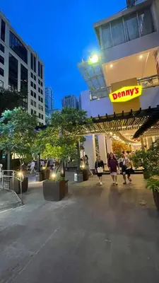 a group of people walking outside of a building at 2 bedroom Luxury Condo in Eastwood with Scenic City view, unli wifi and netflix in Manila