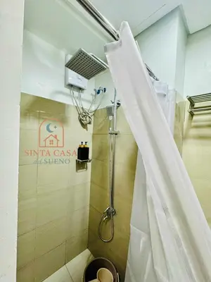 a bathroom with a shower with a shower curtain at Sinta Casa del Sueno MOA Stay with Pool and Wi-fi in Manila