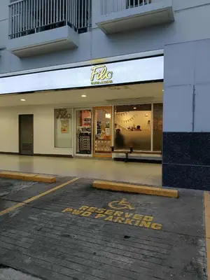 an empty parking lot in front of a store at Sea Residences Golden Empire in Manila