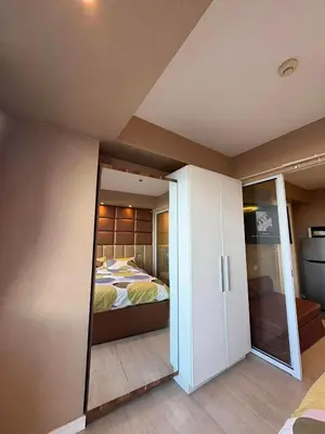 a bedroom with a bed and a sliding glass door at La Casa 543 in Manila