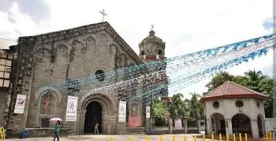an old church with a person standing in front of it at Auntie's in Tanza