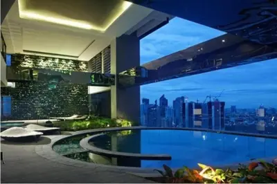 a swimming pool in a building with a view of a city at E-Studio,Best Sunset Pool,Luxury,Hotel Style in Manila