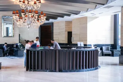 a group of people standing around a bar in a lobby at E-Studio,Best Sunset Pool,Luxury,Hotel Style in Manila