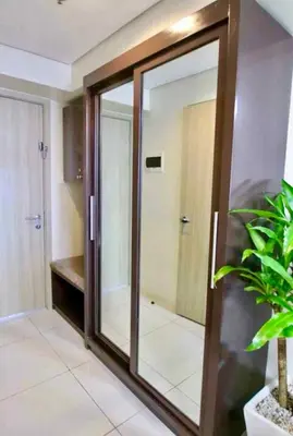 a glass door in a bathroom with a shower at Breeze Staycation by Charmed in Sampong