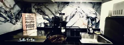 a kitchen with a sink and a counter top at High Rise 2br In the Makati Skyline with KTV Pools in Manila