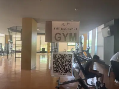 a sign in a gym with people exercising on ellipticals at Levi & Moon Relax and Chill in Manila
