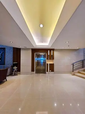 an empty lobby with a door in a building at Maison dela Mer SMDC Breeze Residences Pasay in Manila