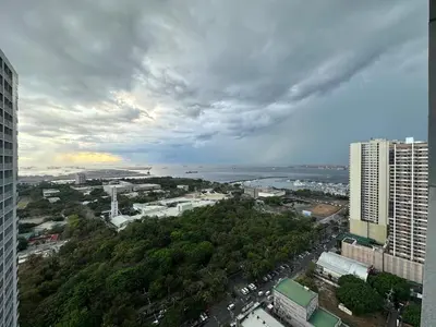 an aerial view of a city with buildings and trees at Maison dela Mer SMDC Breeze Residences Pasay in Manila