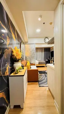 a living room with a couch and a table at Horiyama staycation azure in Manila
