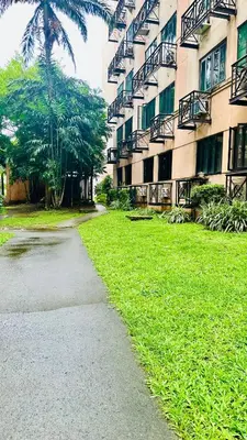 a sidewalk in front of a building with a grass yard at Terravive in Manila