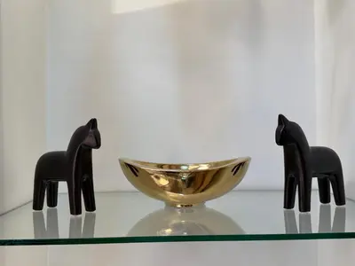two black chairs and a bowl on a glass table at Luxury 2BR w Balcony BGC Taguig near Venice Mall in Manila