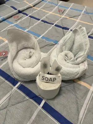 a pair of white sandals with a soap sign on them at Sea Residences Condotel With Balcony, by Rose in Manila