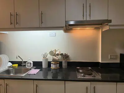 a kitchen with a sink and a counter top at Sea Residences Condotel With Balcony, by Rose in Manila