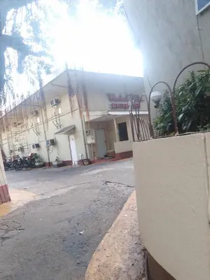 an empty street in front of a building at Sunvalley B&b in Manila