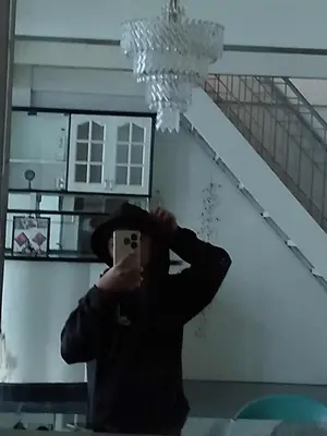a person taking a picture in front of a mirror at Sunvalley B&b in Manila