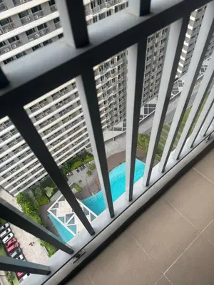 an aerial view of a pool from a balcony of a building at FAME RESIDENCES CONDO-TEL Near EDSA Shang in Manila