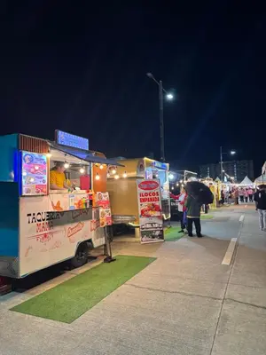 a food stand with a food truck at night at Maple Grove Yasuragi Stay in General Trias