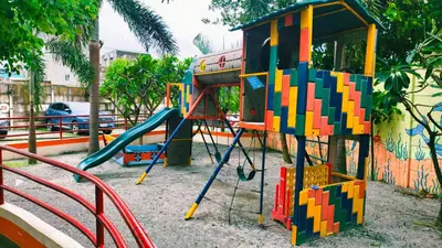 a playground with a slide and a play structure at Cozy Corner at Paseo Verde with Free On-Site Private Parking in Manila
