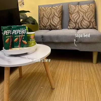 a living room with a couch and a table at JAZZ staycation in Manila