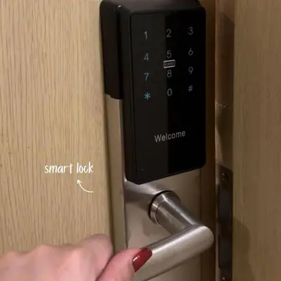 a person unlocking a door with a smart lock at JAZZ staycation in Manila
