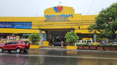a yellow walmart store with a red car parked in front at Dainty Den LF508 - Comfy & Chic Home beside Enchanted Kingdom in Santa Rosa