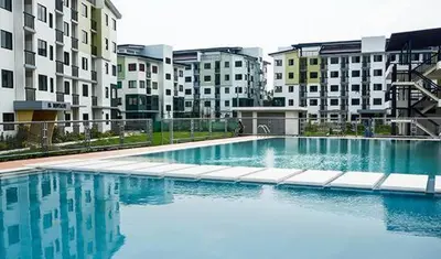 a large swimming pool in front of some buildings at Dainty Den LS217- Chic & Relaxing Stay Near Enchanted Kingdom in Santa Rosa