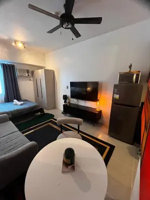 a living room with a couch and a table at Light Lux in Manila
