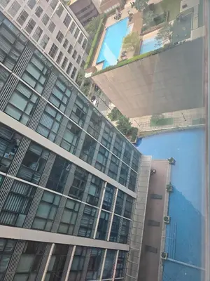 an aerial view of a tall building at Modern BGC One Uptown 1BR near Grand Hyatt Uptown Mitsukoshi Malls and St Lukes Medical Center in Manila