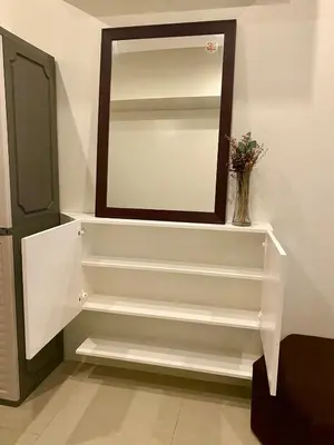 a staircase with a mirror in a room at Affordable Nordic Style Condo in Makati in Manila