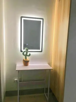 a small cactus sitting on a table under a window at Cloud 1979 at Shore 2 Tower 2 in Manila