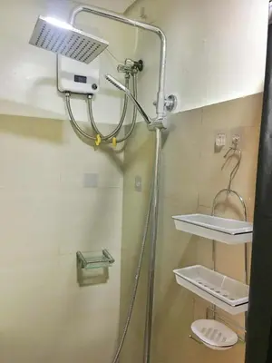 a shower in a bathroom with a sink and a toilet at Cloud 1979 at Shore 2 Tower 2 in Manila