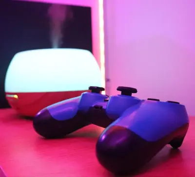a video game controller sitting on top of a table at Cozy and Affordable Loft Condo in Manila Center in Manila