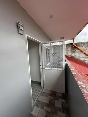 an open door in a room with a balcony at Diego Residences in Manila