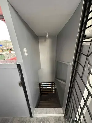 a stairway leading up to a building with a stair railing at Diego Residences in Manila