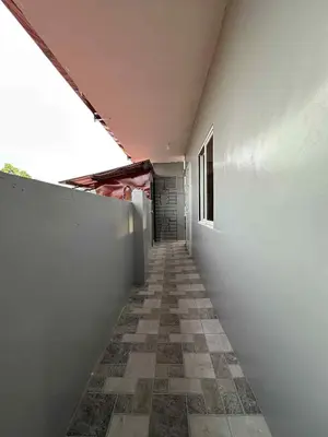 a hallway of a building with a tile floor at Diego Residences in Manila