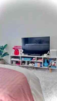 a flat screen tv on a white entertainment center at MG Labels Property in Manila