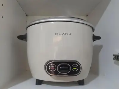 a white toaster sitting on top of a counter at Uptown Parksuites BGC Cosy Hotel Vibe Flat near St Lukes, Uptown Mall, Mitsukoshi and Grand Hyatt in Manila