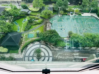 an aerial view of a park with a playground at NEW 2-Bedroom 2-Bath Condo - Flair Towers, near Greenfield District, Ortigas in Manila