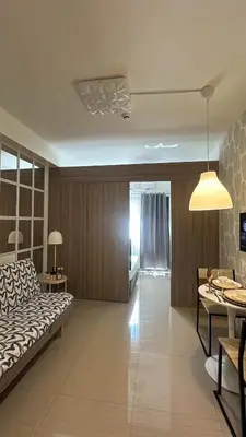 a living room with a couch and a table at CozyCalmStaycation in Manila