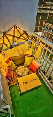 a tent with pillows and a sign that says elite supper a store at OHE space at shore in Manila