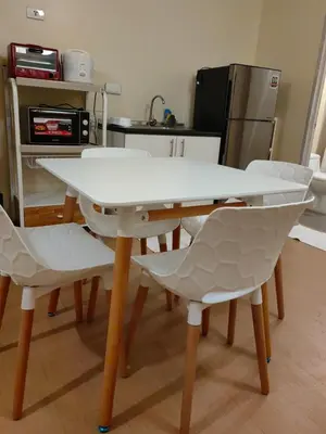 a white table and chairs in a kitchen at unit 130 Studio Type Avida Cityflex BGC in Manila