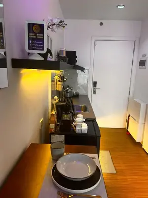 a kitchen with a table with a plate on a counter at Zhafira Retreat in Manila