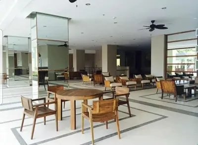 a dining room with tables and chairs and a ceiling at 1BR LaVerti Cloud Nine Suite Family Affordable Staycation in Manila