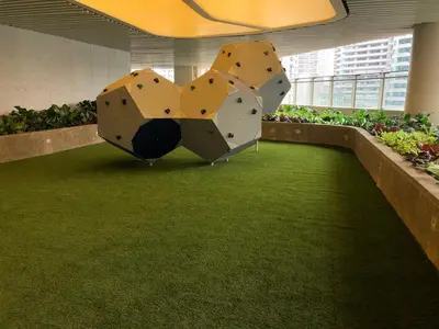 a rock climbing exhibit in an office building at Affordable Condo in Makati Air Residences in Manila